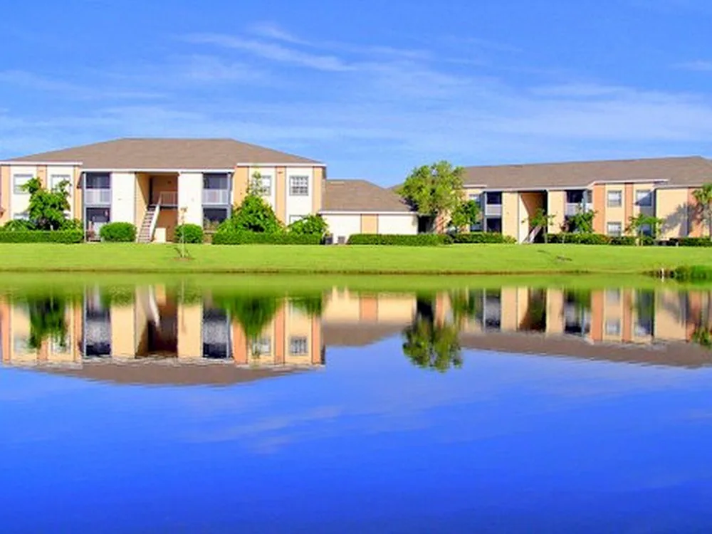Indian River apartment buildings reflected in a lake