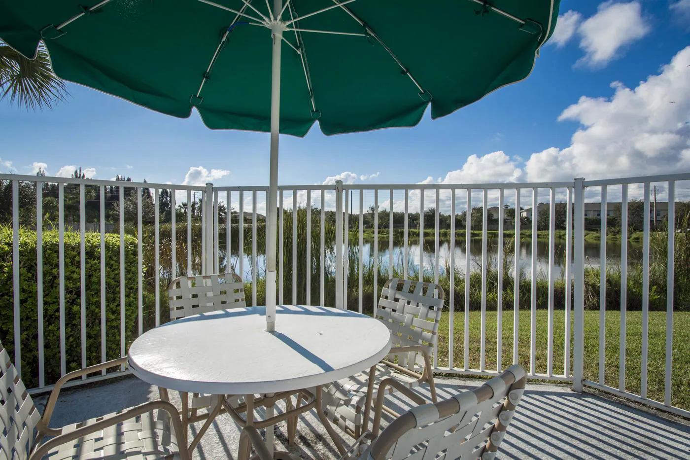 Poolside seating overlooking the community lake