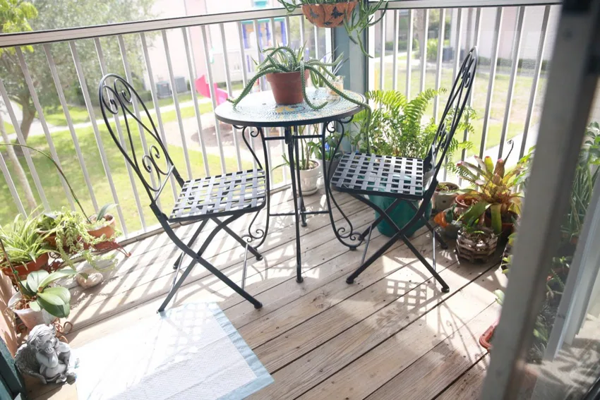 Furnished screened balcony at an apartment home